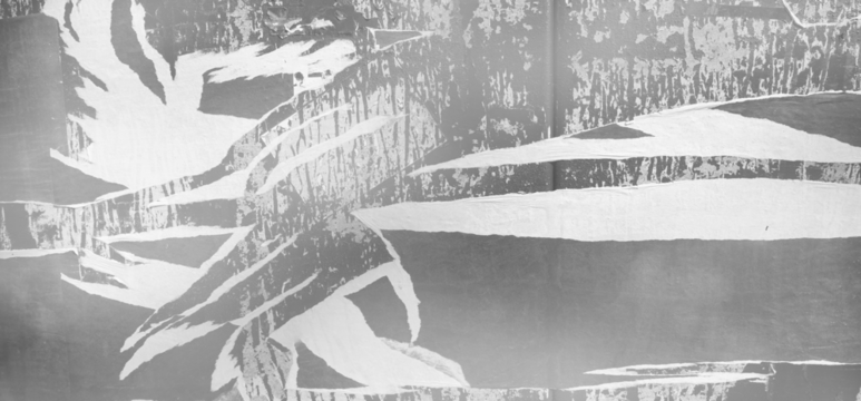 transparent texture of a wall of torn posters