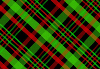 Close up view of a festive plaid tartan fabric pattern with bold green and red intersecting lines, accented by gold and black threads, ideal for textile design and seasonal decor