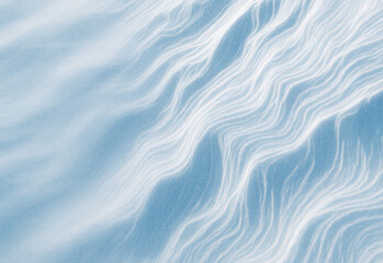 Hyper-detailed abstract landscape of blue wind-sculpted ridges and flowing lines across a smooth surface, evoking serene movement, calm atmosphere, and tactile texture.