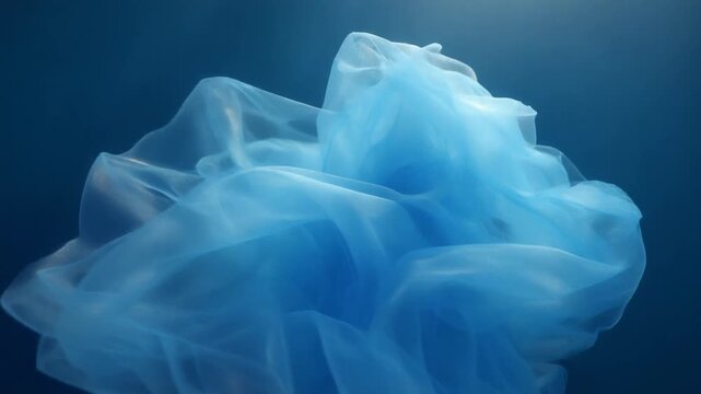 Underwater Veil Dance &ndash; A 5-Second HD Video Capturing Blue Sheer Fabrics Floating Gracefully Like Veils Beneath the Ocean Surface, Immersed in Tranquil Light and Meditative Motion