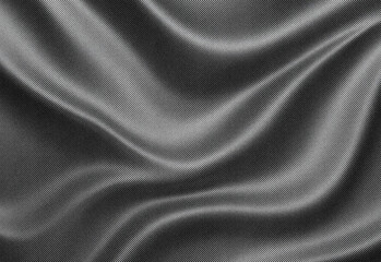 Close-up view of flowing abstract fabric texture in grayscale, featuring silky smooth folds, soft highlights and shadows, a subtle dotted weave, and a cinematic aesthetic