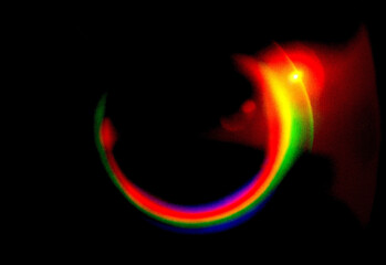 Abstract neon rainbow arc on a dark background with a circular light ring and vivid spectrum colors blending together, ideal for technology, design, and promotional visuals