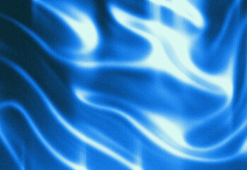 Abstract flowing blue fabric texture with soft waves and luminous highlights creating a dynamic, modern background suitable for technology, design, advertising, and branding