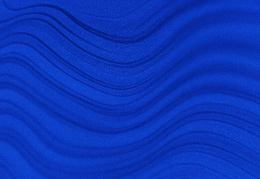 Abstract blue texture with smooth flowing wavy lines and soft gradients, resembling fabric ripples or ocean currents in cool tones, ideal for backgrounds and tech design projects