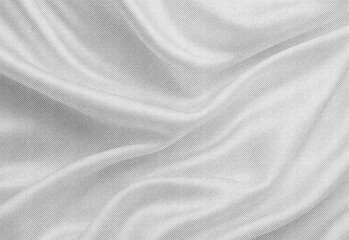 Fototapeta premium Close up of soft gray fabric with flowing folds and subtle woven texture, abstract background ideal for fashion, textile, design, or product photography projects