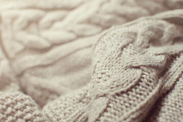 ニット生地のテクスチャ　あたたかい冬物の衣類　セーター　カーディガン　アラン模様