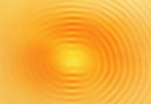 Close-up abstract orange gradient with concentric ripple patterns and a luminous center, creating a warm sunburst texture ideal for backgrounds, design projects and branding