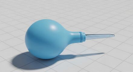 Blue rubber bulb syringe with clear tip on white grid surface medical