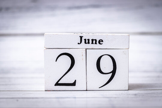 Wooden calendar blocks display June 29, representing a significant date for events or milestones. Ideal for planning, organization, and decor in workspaces.
