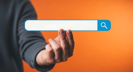 Hand holding a search bar on an orange background for online search