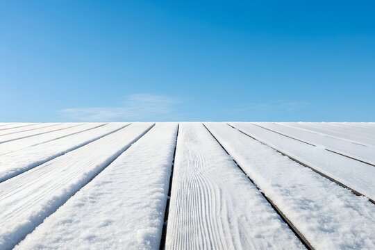 Ultra realistic white painted wood planks with snow dusting against a clear blue sky