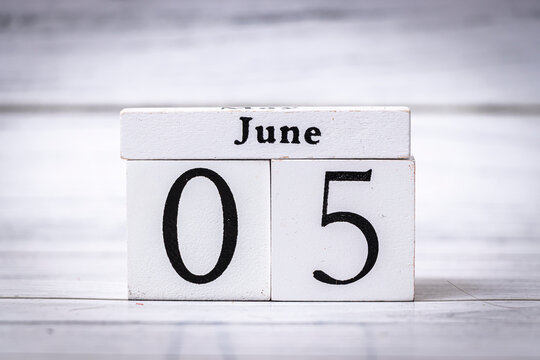 A wooden calendar block shows the date June 05. The minimalistic design and neutral color palette make it suitable for various commercial applications.