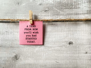 Motivational Quote “A Year From Now You’ll Wish You Had Started Today” on Clipped Pink Card...