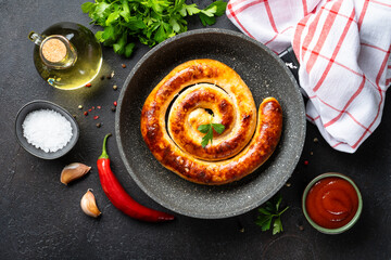 Sausages, German food bratwurst in the pan, grilled dish.