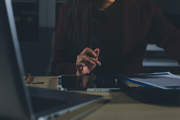 Customer signing a real estate contract in real estate agency.