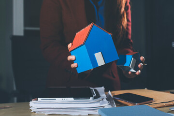 Customer signing a real estate contract in real estate agency.