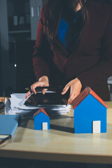 Customer signing a real estate contract in real estate agency.