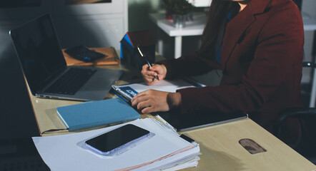 Customer signing a real estate contract in real estate agency.