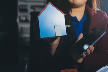 Customer signing a real estate contract in real estate agency.