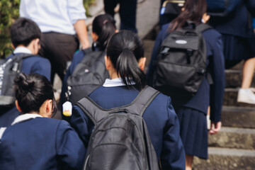 Group of school children students outdoor excursion, guided tour in the city with guide, docent...