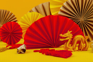 Happy Chinese New Year traditional concept. Oriental asian style paper fans on red background