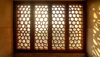 Beautifully intricate lattice window casts geometric shadows as sunlight streams through, creating warm and inviting atmosphere. design showcases traditional craftsmanship and architectural
