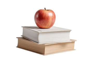 A red apple rests atop two books, one white and one tan, against a dark background