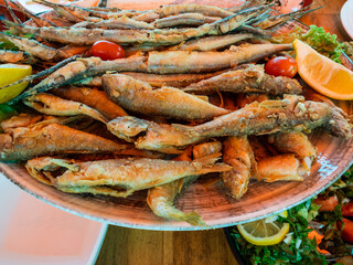 fried local Black Sea fishes on plate close up