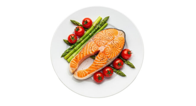 Isolated fresh salmon fillet with asparagus and cherry tomatoes on a white plate, tasty food