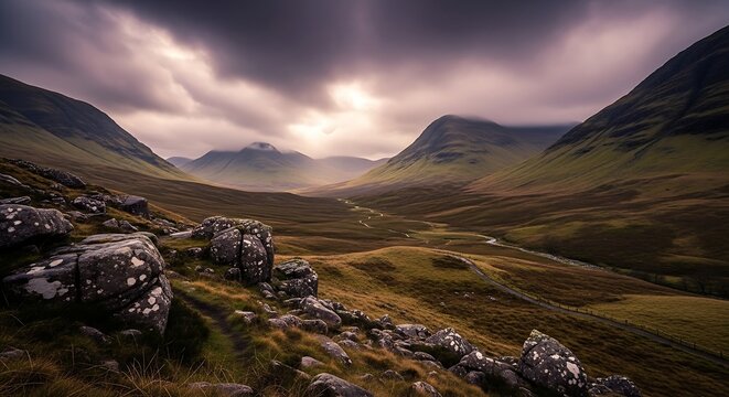 Dramatic mountain valley under moody sky
