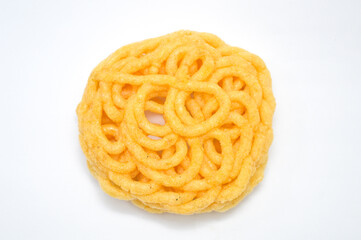 A bright yellow, intricate fried Indonesian cracker with a woven spiral pattern, isolated on a clean white background. Represents crispy traditional Asian snack food, unique culinary textures.