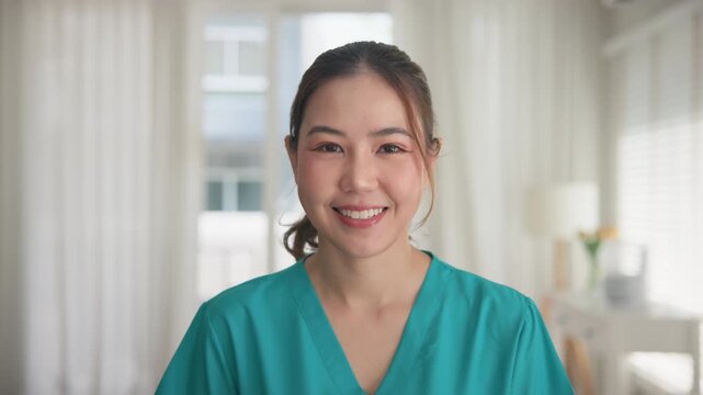 Young adult woman asia people anti aging expert modern nurse happy smile worker live home video call screen selfie look at camera mental health care Online digital virtual asian tele consult clinic.