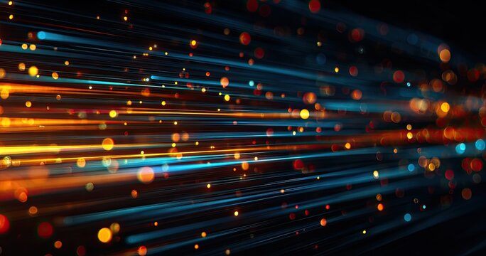 Streaking light forms a dynamic, abstract pattern of blue, orange and yellow