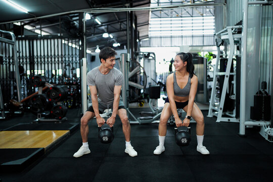 gym sport fitness exercise health woman weight training kettlebell trainer coach instructor personal equipment strong healthy fit active workout body man activity - Powered by Adobe