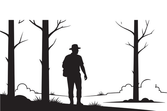 Silhouette of a hiker standing in a forest clearing
