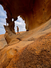 Man Walking at Arco de Las Peñitas, Fuerteventura, Spain