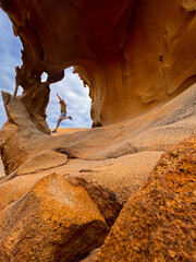 Man Jumping at Arco de Las Peñitas, Fuerteventura, Spain