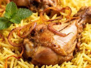 Close-up Macro Shot of Chicken Biryani with Saffron Rice and Fried Onions