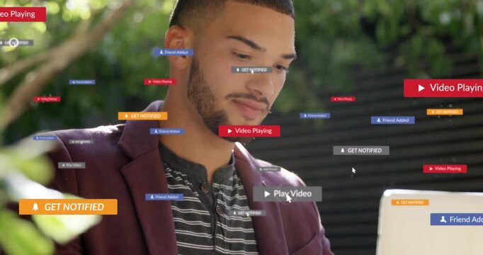 Man typing outdoor starting tech causing animated notify or play tags clustering around laptop face