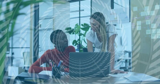 Standing woman leaning, pointing at laptop, colleague noting for business under spiral overlay