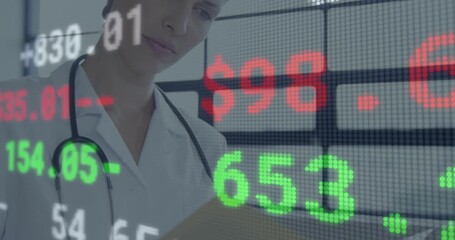 Woman doctor reading clipboard in clinic starting scrolling finance ticker over face and looking up - Powered by Adobe