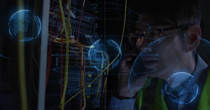 Tech getting call, checking LEDs, tracing cables while AR globes growing over rack for network fix