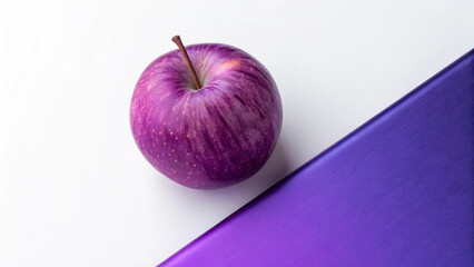 Vibrant Purple Apple on Background White Surface Next to Purple Paper fruit food