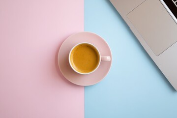 Coffee in Pink Cup on Blue and Pink Split Background with Laptop