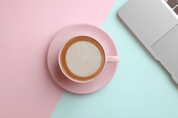 Morning Coffee on Desk with Laptop and Pastel Colored Background