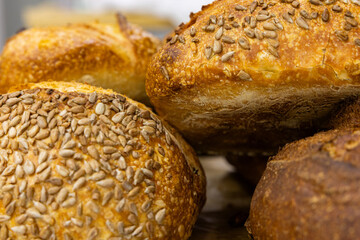 Fresh bread from the oven at a small artisan bakery at home. Very healthy sourdough bread products of various types. 