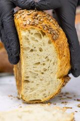 Fresh bread from the oven at a small artisan bakery at home. Very healthy sourdough bread products of various types. 