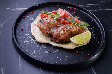 Roasted Chicken on Flatbread With Tomato Salad, Lime Wedge