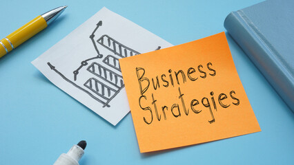 Planning successful business strategies with growth charts and notes, perfect for presentations and marketing campaigns.
