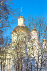 Beautiful orthodoxe church with golden domes on a blue sky